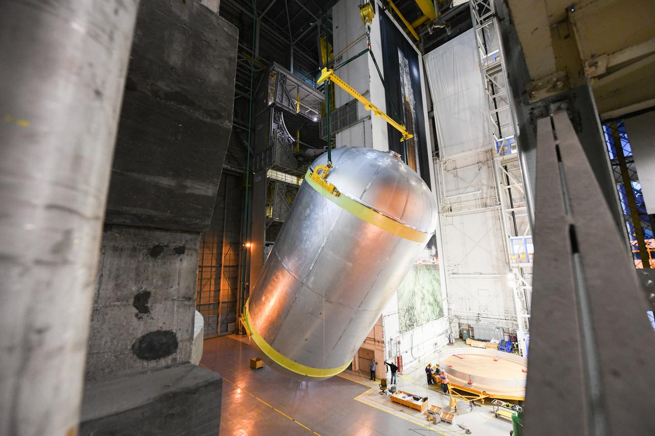This image shows the latest progress NASA has made in manufacturing the liquid oxygen tank for the second core stage of NASA’s Space Launch System (SLS) rocket. The liquid oxygen tank will be used for the first crewed mission, Artemis II, of the agency’s Artemis program. Teams at NASA’s Michoud Assembly Facility in New Orleans recently completed internal cleaning of the liquid oxygen, or LOX, tank at the facility. Following the cleaning, crews prepared the propellant tank for the next phase of phase of assembly in a different area of the factory by moving, or breaking over, the tank from a vertical to horizontal position. The LOX tank is one of five major elements that make up the rocket’s massive 212-foot-tall core stage. The propellant tank holds 196,000 gallons of supercooled liquid oxygen to help fuel four RS-25 engines, and the internal cleaning ensures no contaminants make their way into the complex propulsion and engine systems of the deep space rocket. The stage, which includes a cluster of four RS-25, will produce more than 2 million pounds of thrust to help launch the SLS rocket and astronauts aboard NASA’s Orion spacecraft around the Moon for Artemis II.   NASA is working to land the first woman and the next man on the Moon by 2024. The agency’s SLS rocket offers more payload mass, volume capability and energy to speed missions through deep space and enable NASA’s Artemis lunar program. SLS, along with Orion, the human landing system, and the Gateway in orbit around the Moon are NASA’s backbone for deep space exploration. No other rocket is capable of carrying astronauts in Orion around the Moon in a single mission.